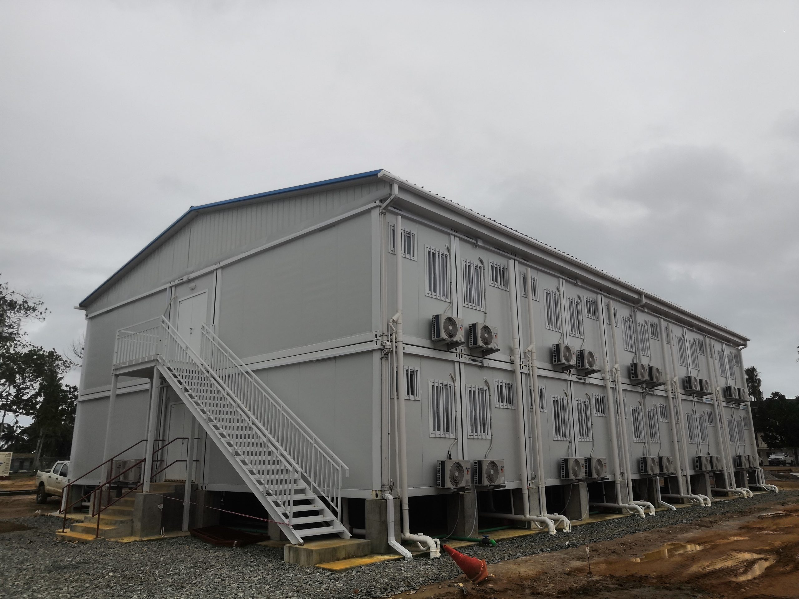 Researchers analyze utilizing repurposed shipping containers as structural components in Lida Group's prefabricated modular homes to accommodate growing populations outside closed container labor camps
